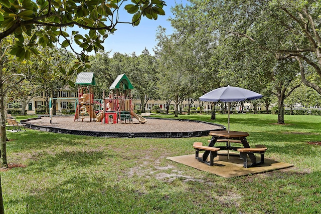 view of playground with a lawn