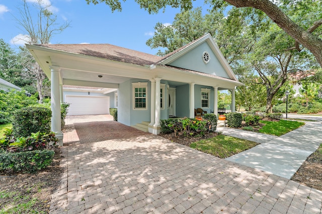 view of front of home with a porch and a garage