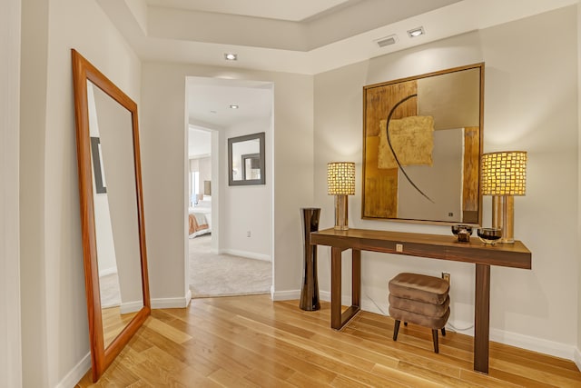 hallway featuring wood-type flooring