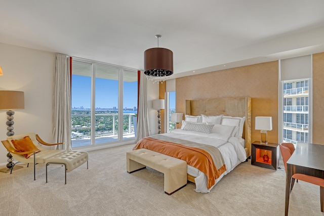 bedroom featuring light carpet