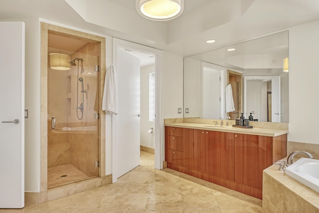 bathroom featuring independent shower and bath and vanity