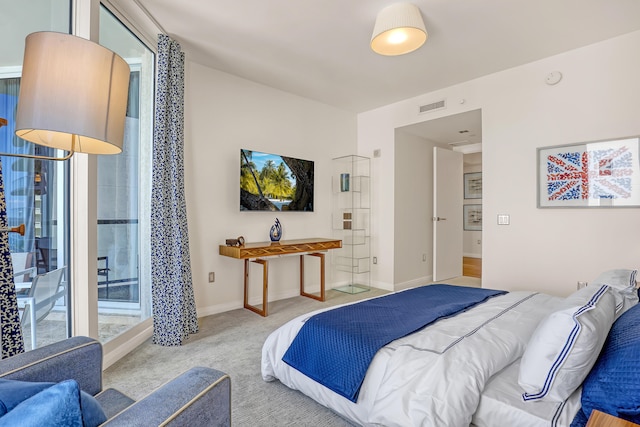 bedroom with light colored carpet