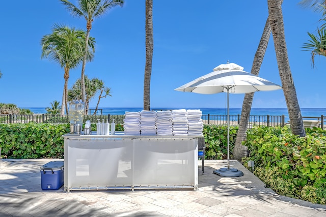 view of patio with a water view