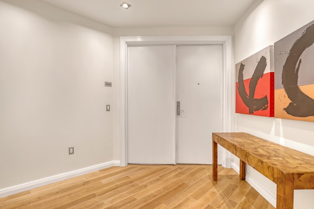 doorway with wood-type flooring