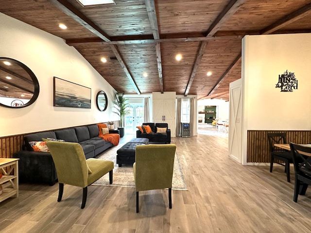 living room featuring wood ceiling, hardwood / wood-style floors, vaulted ceiling with beams, and wooden walls