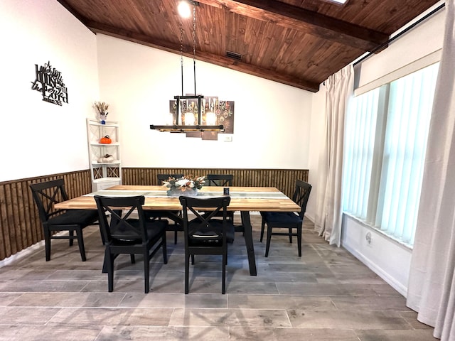 dining space featuring a wealth of natural light, lofted ceiling, and wooden ceiling