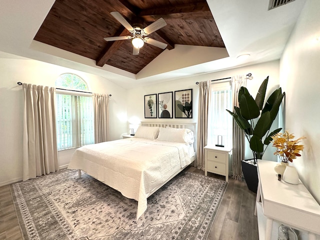 bedroom with ceiling fan, lofted ceiling with beams, hardwood / wood-style flooring, and wooden ceiling