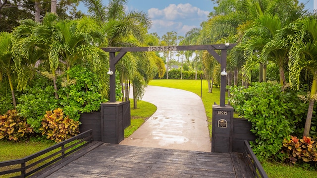 view of property's community with a yard and a deck