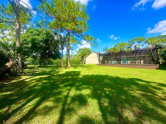 view of yard featuring a lanai