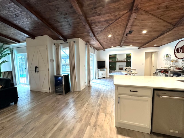 kitchen featuring vaulted ceiling with beams, white cabinets, wine cooler, wood ceiling, and light hardwood / wood-style floors