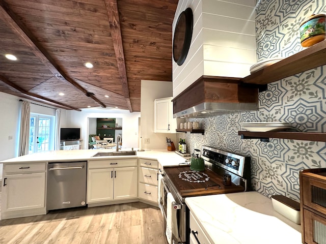 kitchen featuring stainless steel appliances, light hardwood / wood-style floors, white cabinets, and sink