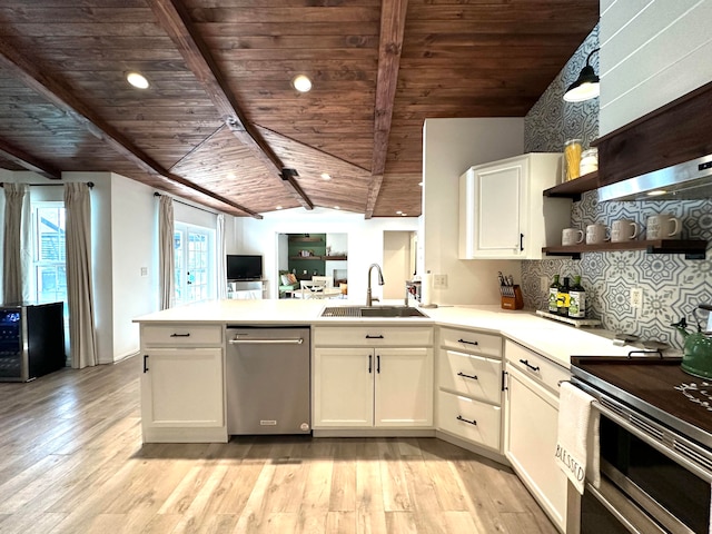 kitchen featuring light hardwood / wood-style flooring, wood ceiling, appliances with stainless steel finishes, vaulted ceiling with beams, and white cabinetry