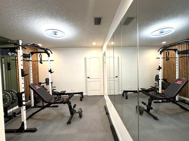 workout area with a textured ceiling