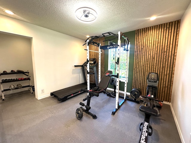 workout area with a textured ceiling