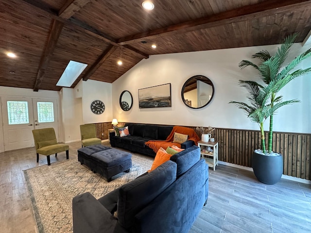 living room with wood-type flooring, lofted ceiling with skylight, and wooden ceiling