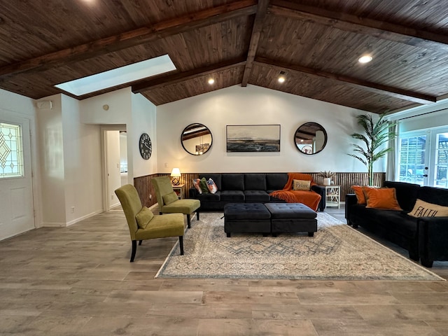 living room with wood-type flooring, wood ceiling, and lofted ceiling with skylight