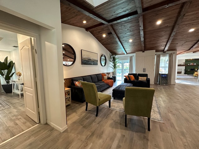 living room with wooden ceiling, hardwood / wood-style floors, and vaulted ceiling with beams