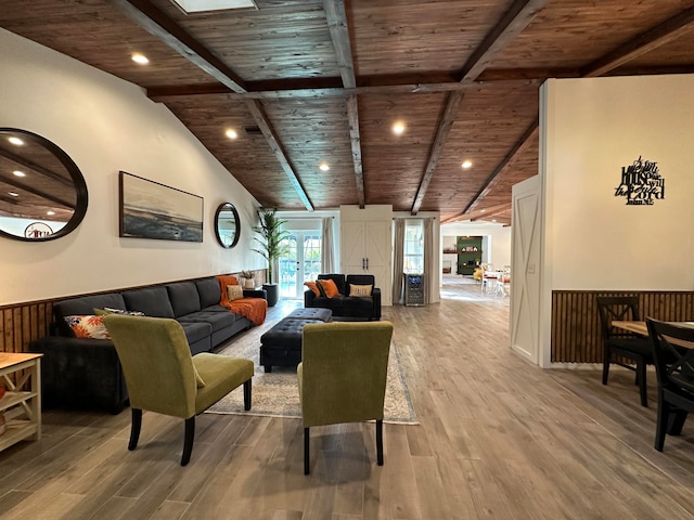 living room with hardwood / wood-style flooring, vaulted ceiling with beams, and wood ceiling