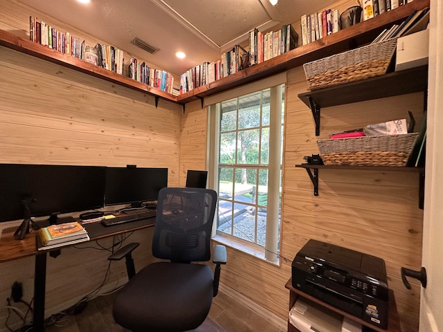 office area with wood walls and hardwood / wood-style floors