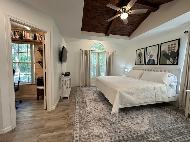 bedroom with lofted ceiling with beams, ceiling fan, wooden ceiling, and hardwood / wood-style flooring