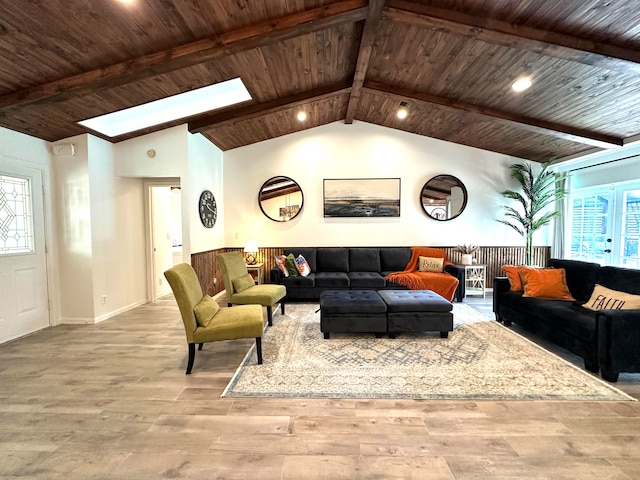 living room featuring light wood-type flooring, wooden ceiling, and vaulted ceiling with skylight