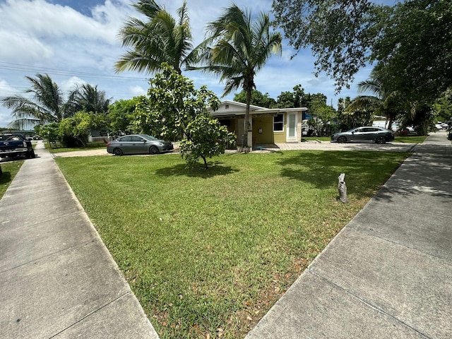 view of front of home with a front lawn