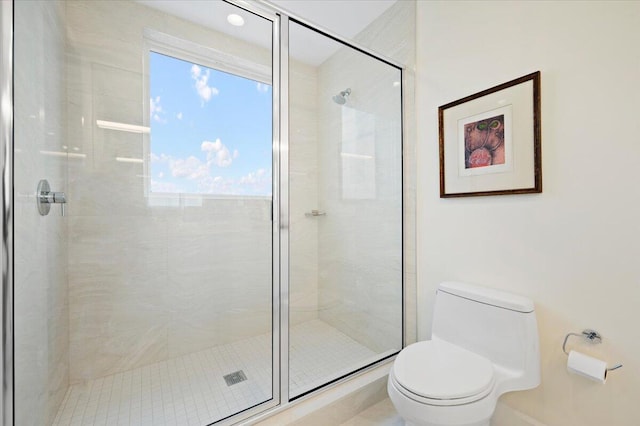 bathroom with walk in shower and toilet