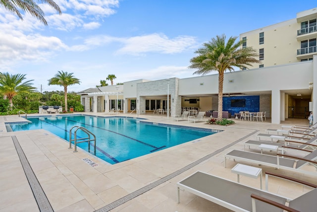 view of swimming pool with a patio area