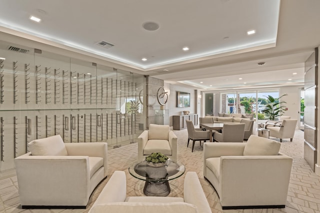 living room featuring a tray ceiling