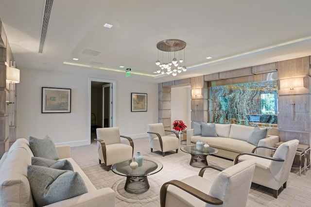 living room with light carpet, a raised ceiling, and a chandelier