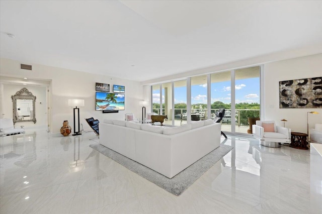 living room featuring a wall of windows