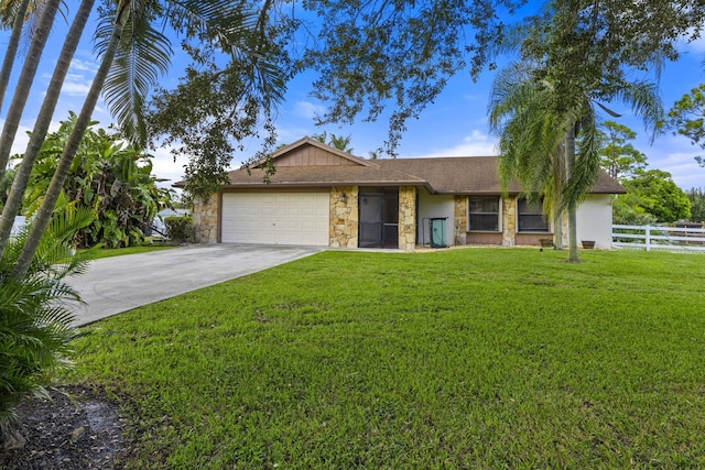 single story home with a garage and a front lawn