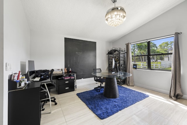 office space with vaulted ceiling, light tile patterned flooring, and a textured ceiling