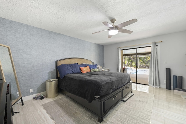 bedroom with a textured ceiling, ceiling fan, and access to exterior