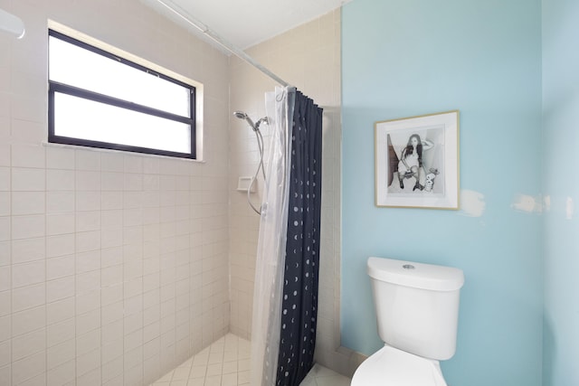 bathroom with toilet and curtained shower