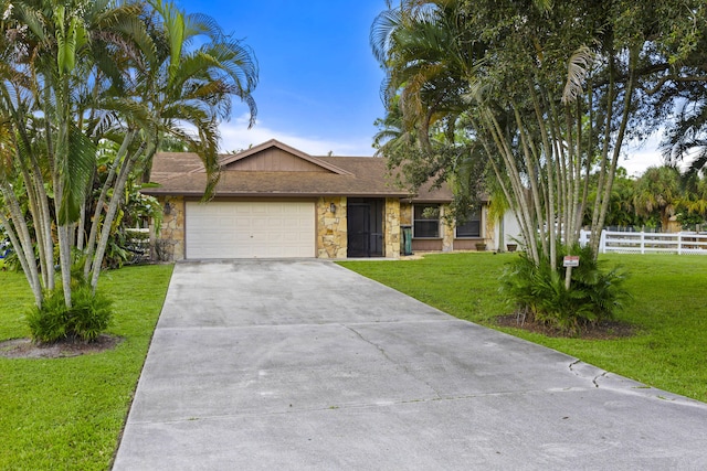 ranch-style house with a garage and a front lawn