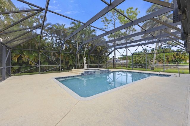 view of swimming pool featuring a patio, a lanai, and an in ground hot tub