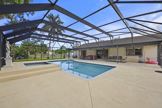 view of swimming pool featuring glass enclosure and a patio