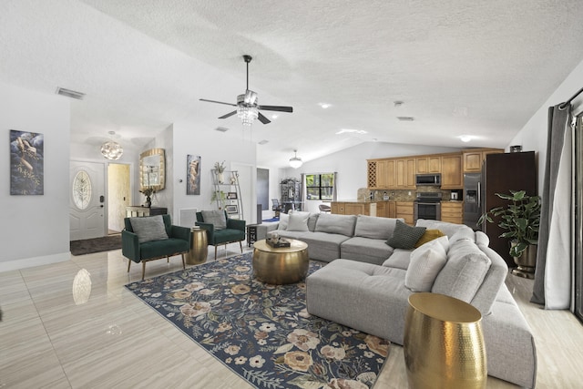 living room with lofted ceiling, a textured ceiling, light tile patterned floors, and ceiling fan