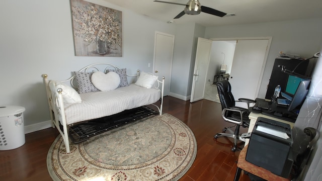 office space featuring ceiling fan and dark hardwood / wood-style flooring