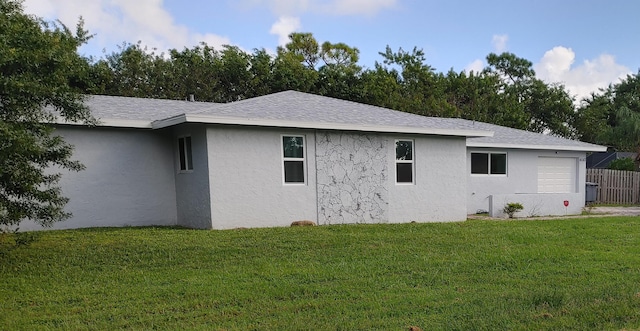 view of side of property featuring a yard