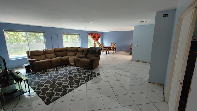 living room with tile patterned flooring