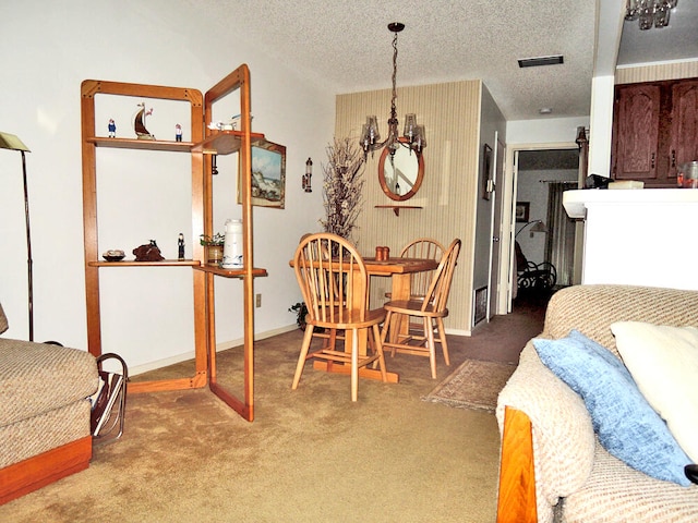 carpeted dining area featuring a textured ceiling and a notable chandelier