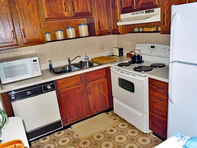 kitchen with white appliances and sink