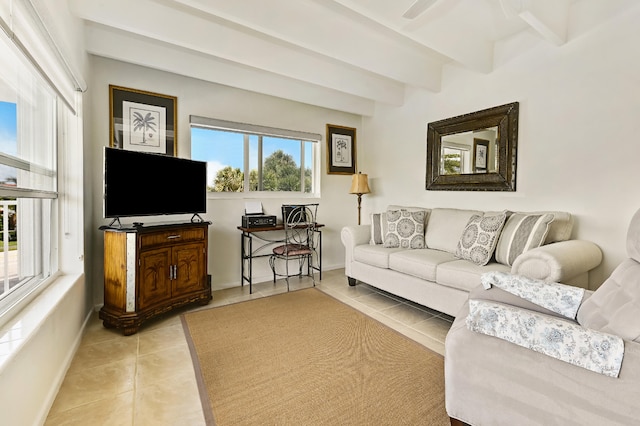 living room with beamed ceiling and light tile patterned floors