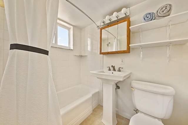 bathroom with toilet and shower / bath combo