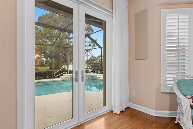 doorway to outside with french doors and hardwood / wood-style flooring