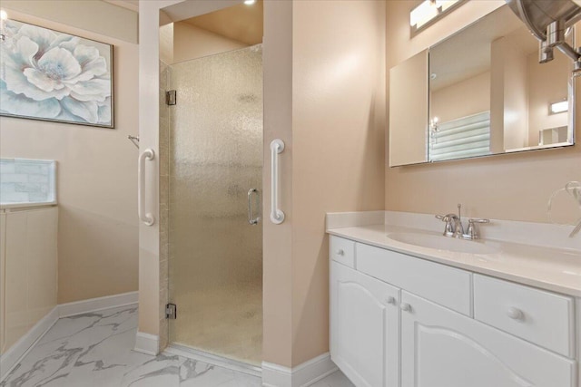 bathroom featuring vanity and an enclosed shower