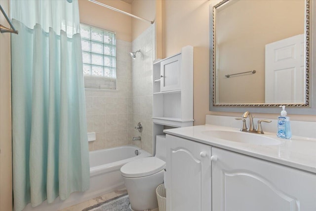 full bathroom featuring shower / bathtub combination with curtain, vanity, and toilet