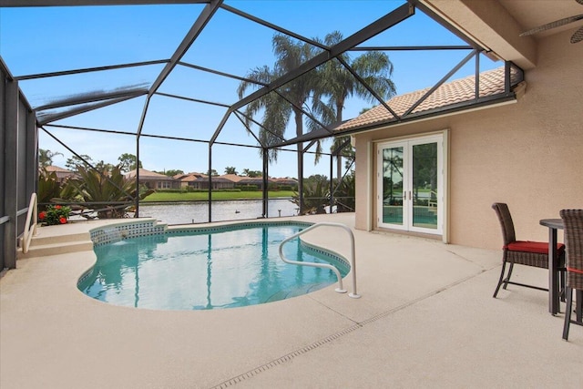 view of swimming pool with a water view, a lanai, and a patio area